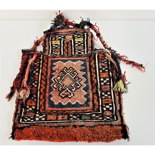 343 - CAUCASUS REGION TRIBAL SALT BAG
with tassle decoration and carry handle, 45cm high