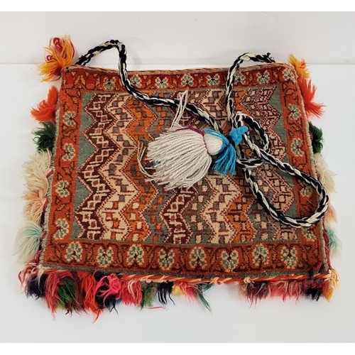 344 - CAUCASUS REGION TRIBAL BAG
with a plaited shoulder strap, 29cm high