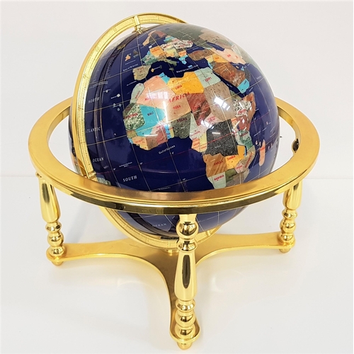 345 - TABLE TOP TERRESTRIAL GLOBE
constructed from specimen stone and mounted on a brass stand with an ins... 