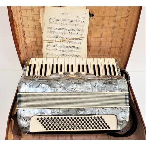 376 - GALANTIO ACCORDIAN
with a mottled grey body with shoulder straps and travel case, with a selection o... 