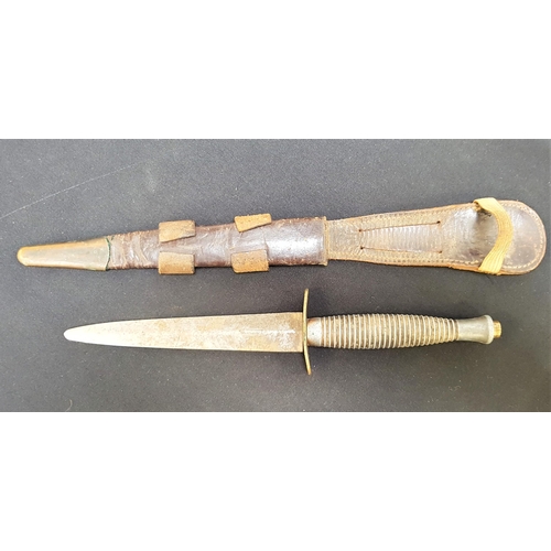 495 - FFAIRBAIRN SYKES STYLE FIGHTING KNIFE
with a 14.7cm stilleto blade and a shaped ribbed handle, with ... 