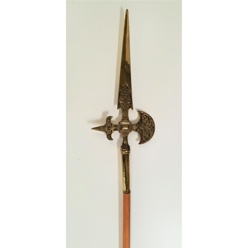 334 - DECORATIVE BRASS HALBERD
with a turned wood shaft, 207cm long