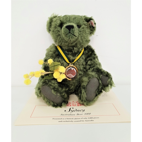 444 - LIMITED EDITION STEIFF SYDNEY AUSTRALIAN BEAR
in green mohair and carrying a branch of 'Wattle' and ... 