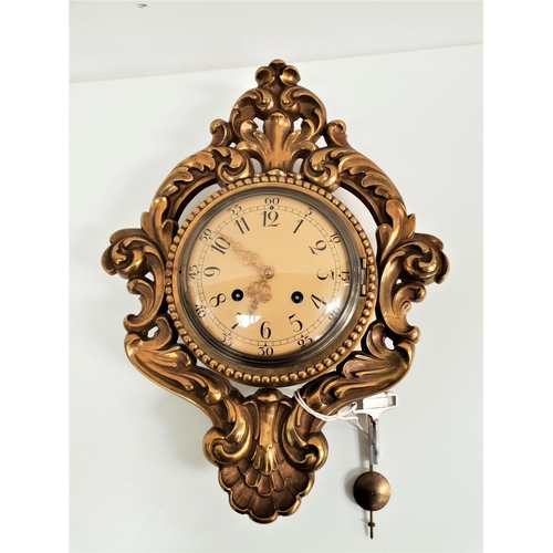 616 - 20th CENTURY SWEDISH GILT BRASS CARTEL CLOCK
with an eight day movement and a cream circular dial wi... 