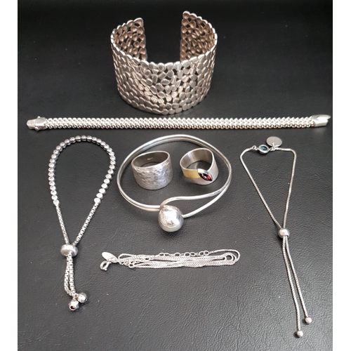 30 - SELECTION OF SILVER JEWELLERY
comprising a pierced cuff bangle, another ball clasp bangle, three bra... 