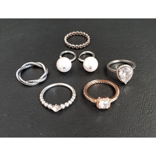 45 - FIVE PANDORA RINGS
comprising a Sparkling Teardrop Halo ring, a Sparkling Twisted Lines ring, a Band... 