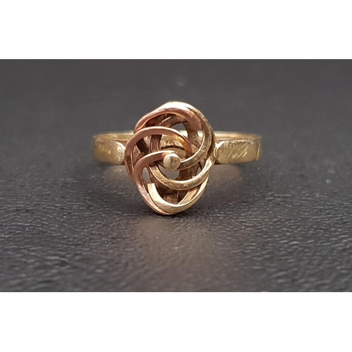 46 - FOURTEEN CARAT GOLD RING
with central pierced and entwined panel in rose and yellow gold, ring size ... 