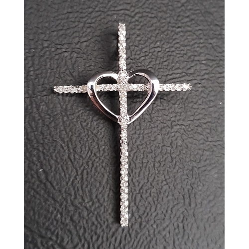 29 - DIAMOND SET CROSS PENDANT
with central heart detail, in unmarked white gold, 3.2cm high