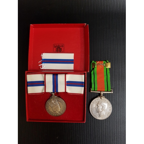 490 - QUEEN ELIZABETH II SILVER JUBILEE MEDAL
boxed with a spare ribbon, together with The Defence Medal w... 