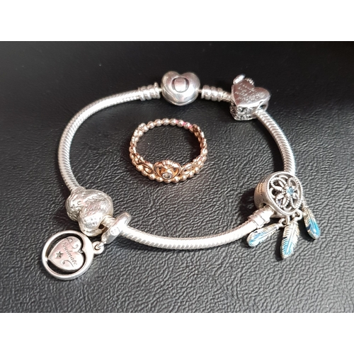 20 - SELECTION OF PANDORA JEWELLERY
comprising a heart clasp Moments silver charm bracelet with four char... 