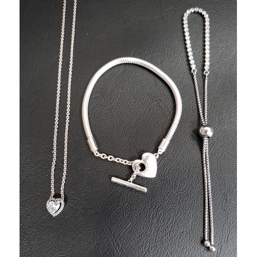33 - SELECTION OF PANDORA SILVER JEWELLERY
comprising a Moments Heart T-Bar Snake Chain Bracelet, a CZ se... 