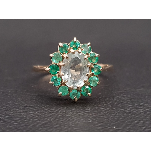 15 - AQUAMARINE AND EMERALD CLUSTER RING
the central oval cut aquamarine approximately 1ct in twelve emer... 