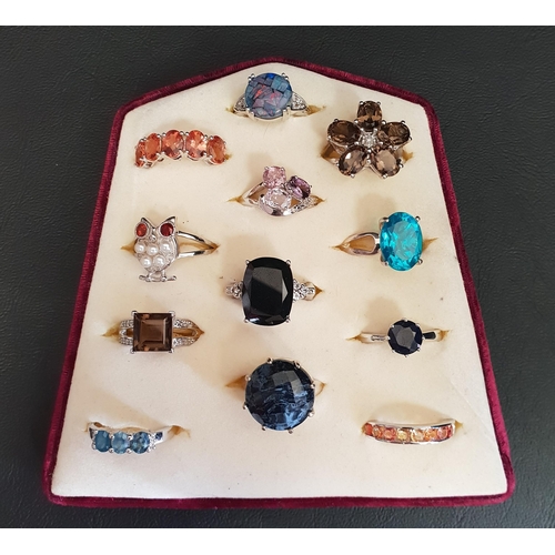 109 - GOOD SELECTION OF TWELVE SILVER RINGS
of various designs including topaz and other gemstones, pearl ... 