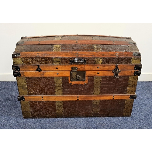 522 - VINTAGE DOME TOP TRUNK
with elm banding and a crocodile effect covering, with side carrying handles,... 