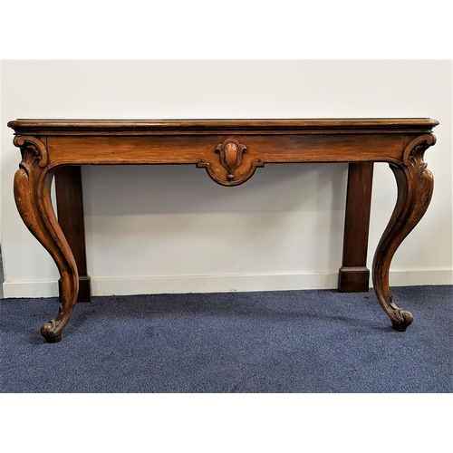 525 - VICTORIAN OAK SERVING TABLE
now lacking its raised back, with a moulded top above a central carved f... 