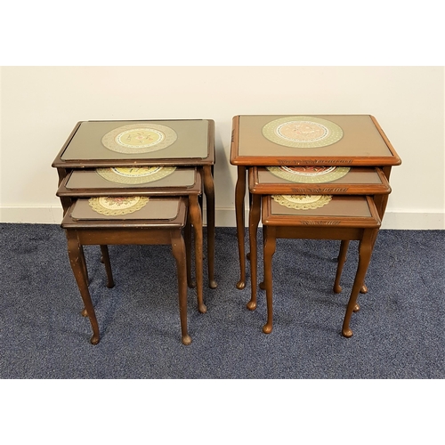 560 - MAHOGANY NEST OF TABLES
with inset glass tops and a chinese circular place mat under the glass, stan... 