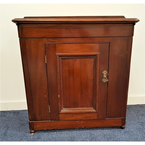 561 - MAHOGANY SIDE CABINET
with a shaped raised back above a moulded top with a panelled cupboard door be... 