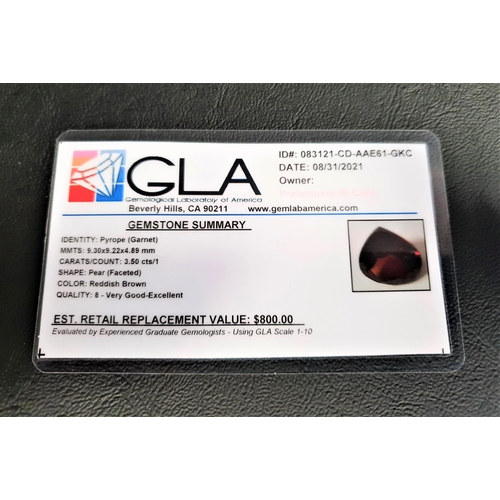 76 - CERTIFIED LOOSE PYROPE GARNET 
the pear cut gemstone weighing 3.5cts, with GLA gemological report st... 