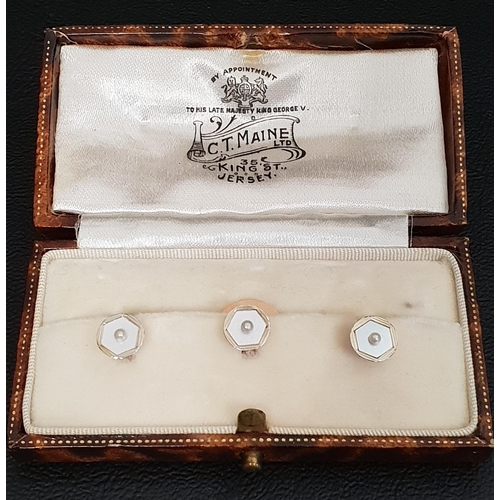 155 - SET OF THREE ENAMEL AND SEED PEARL DRESS STUDS
in eighteen carat and nine carat gold, in fitted box