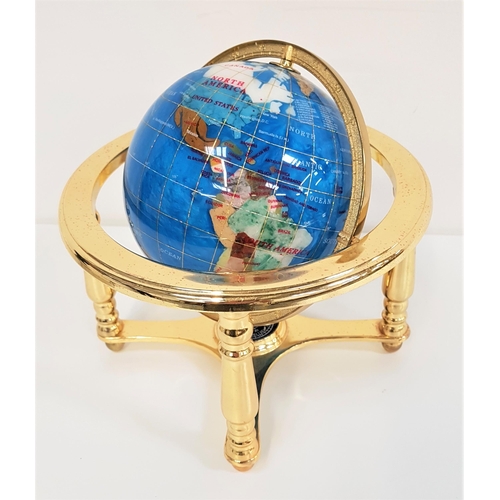 335 - TABLE TOP TERRESTRIAL GLOBE
constructed from specimen stones and mounted on a brass stand with an in... 