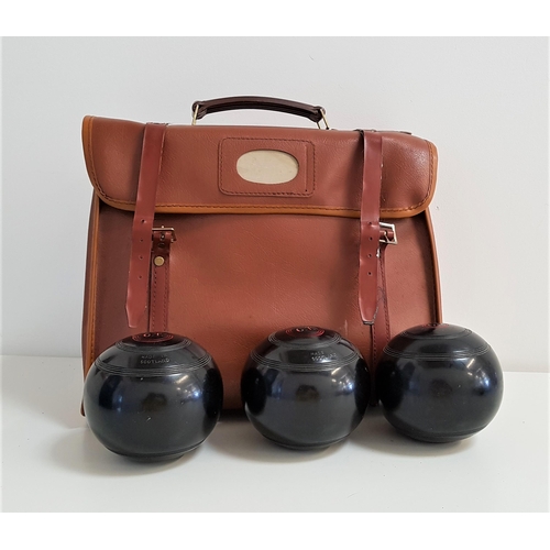 384 - SET OF FOUR THOMAS TAYLOR LAWN BOWLS
with lignoid Tru-Grip, size 5, in a carry case, together with t... 