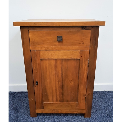 521 - TEAK SIDE CABINET
with a plain rectangular top above a frieze drawer with a panelled cupboard door b... 