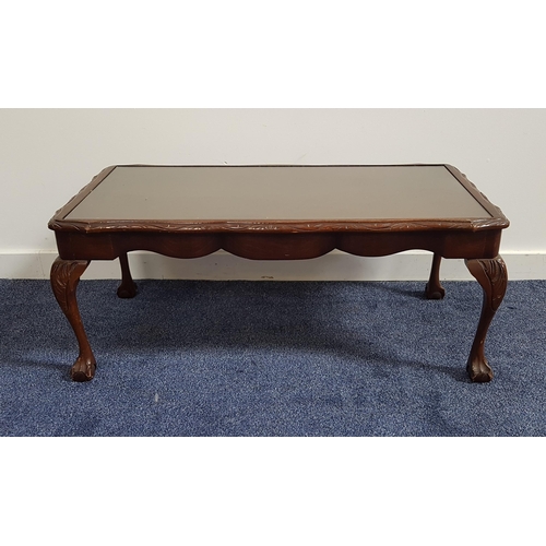 539 - MAHOGANY OCCASIONAL TABLE 
with an inset glass top, standing on cabriole supports with claw and ball... 