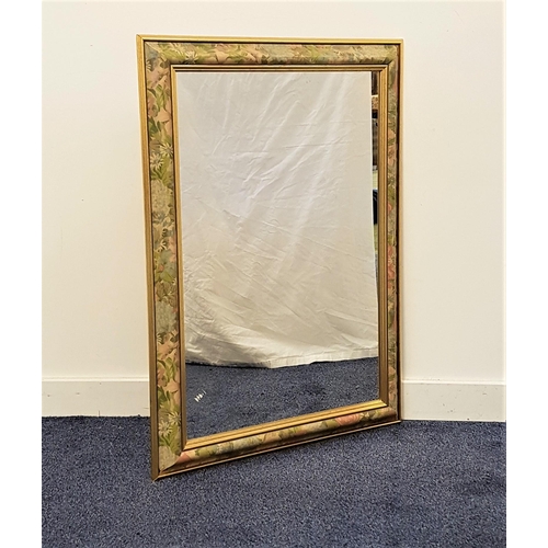 573 - RECTANGULAR WALL MIRROR
in a cushion frame decorated with flowers, with a plain plate, 89cm x 63.5cm