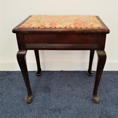 589 - MAHOGANY PIANO STOOL
the padded lift up seat with decorative stud detail and an interior trade label... 