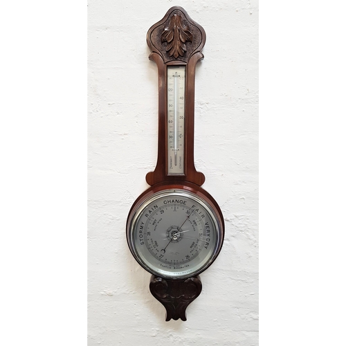 600 - MAHOGANY CASED ANEROID WHEEL BAROMETER
with a thermometer on a silvered scale above a circular silve... 