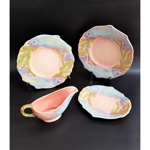 278 - H. WAIN & SONS MELBA WARE POTTERY FISH SERVICE
with a salmon pink ground decorated with salmon, comp... 