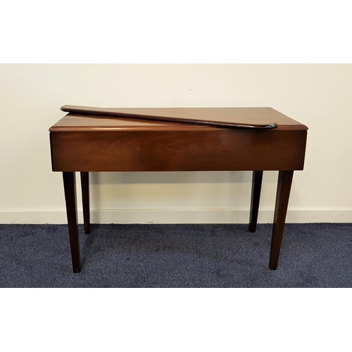 556 - MAHOGANY DROP FLAP TABLE
of narrow proportions with shaped drop flaps above a frieze drawer, standin... 