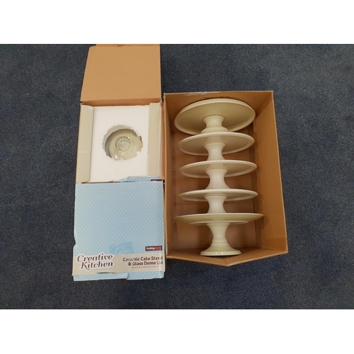 98 - FIVE CERAMIC CAKE STANDS
and two glass dome lids