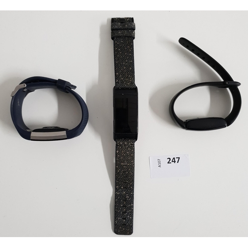 247 - SELECTION OF THREE FITBIT FITNESS TRACKERS 
comprising of one Fitbit inspire 2, one Fitbit charge 3 ... 