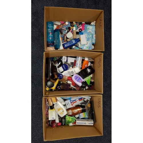 64 - THREE BOXES OF NEW AND USED TOILETRY ITEMS
including: Dove, Benefit, Lancome, Garnier, Rimmel, Giorg... 