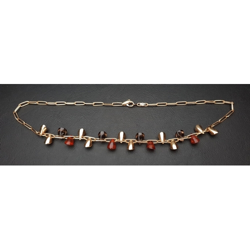 3 - FOURTEEN CARAT GOLD PAPERCLIP LINK NECKLACE 
with alternating gold, amber and smokey quartz triangul... 
