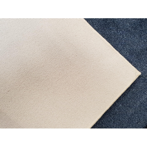 617 - LARGE CREAM GROUND RUG
with a woven edge, 350cm x 300cm