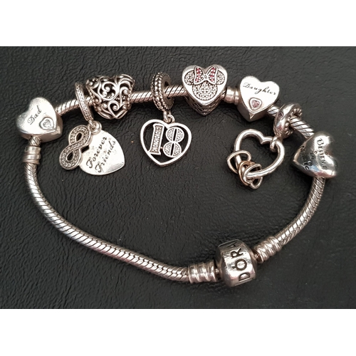 11 - PANDORA MOMENTS SNAKE CHAIN SILVER CHARM BRACELET 
including a Daughter heart charm, a Forever Frien... 