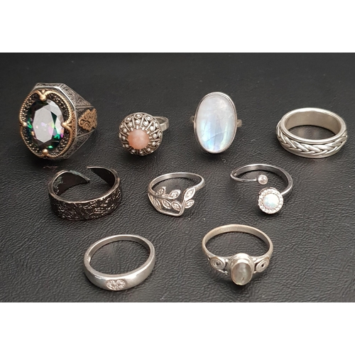 35 - SELECTION OF NINE SILVER RINGS 
including a large dress ring with mystic topaz style stone, a large ... 