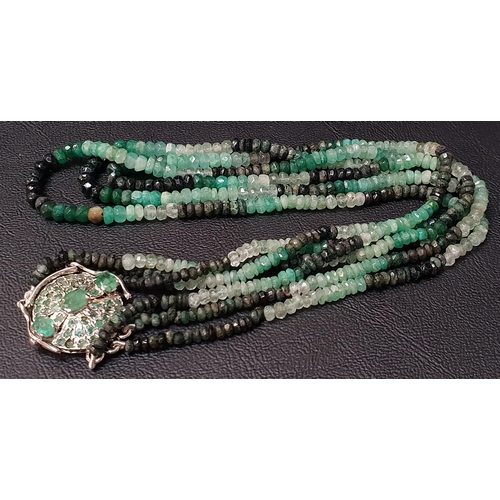 232 - THREE STRAND EMERALD NECKLACE
the emerald beads of graduated colour, with emerald set silver clasp, ... 