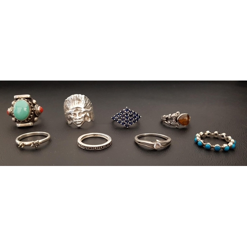 85 - EIGHT SILVER RINGS
of various designs, including turquoise and coral set dress ring, a turquoise ete... 