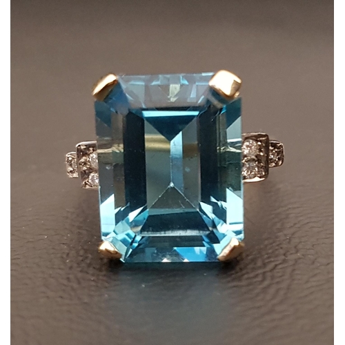 100 - BLUE TOPAZ AND DIAMOND COCKTAIL RING 
the emerald cut blue topaz measuring 11.78mm x 15.6mm x 8.2mm ... 