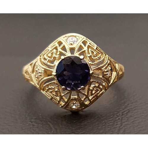 112 - IOLITE AND DIAMOND DRESS RING
the round cut iolite approximately 0.5cts in pierced diamond set surro... 