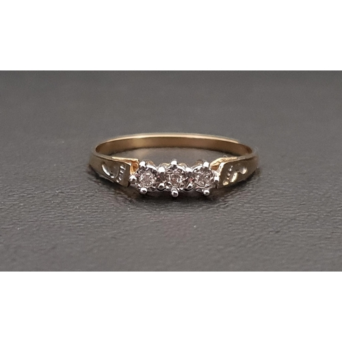 75 - DIAMOND THREE STONE RING
the illusion set diamonds on nine carat gold shank with footprint detail to... 