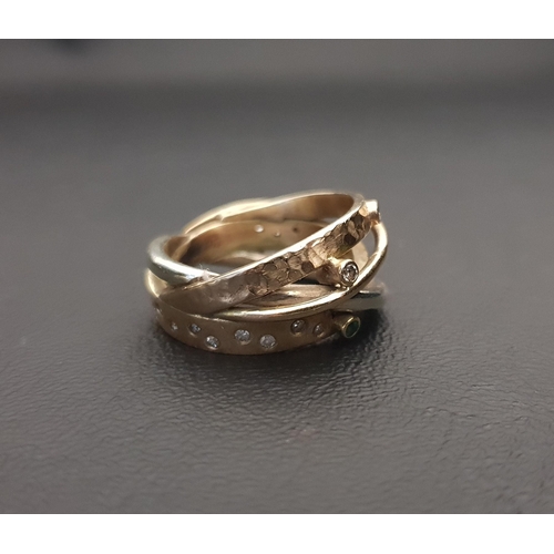 96 - UNUSUAL DIAMOND AND GEM SET RING
formed of different gold bands, one with flush set diamonds and ano... 