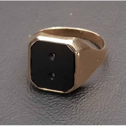 243 - NINE CARAT GOLD SIGNET RING 
set with central pierced black agate, approximately 5.7 grams, ring siz... 