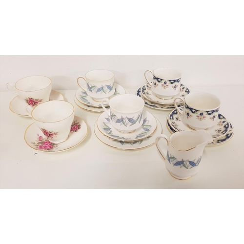 286 - THREE PART TEA SETS
comprising four cups, saucers and side plates of Paragon 'Boniston' design; four... 