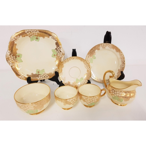 287 - TWELVE PIECE GROSVENOR TEA SET
of gold and white floral design with gilt highlights, comprising twel... 