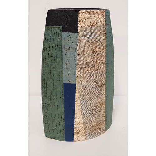 309 - BERNARD IRWIN (b.1953)
studio pottery vase of ellipytical form, decorated in blocks of mottled green...