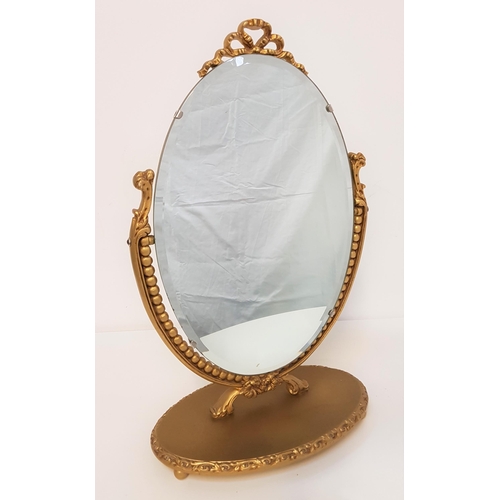 626 - GILTWOOD DRESSING TABLE MIRROR
with an oval bevelled plate on an oval base, 59.5cm high